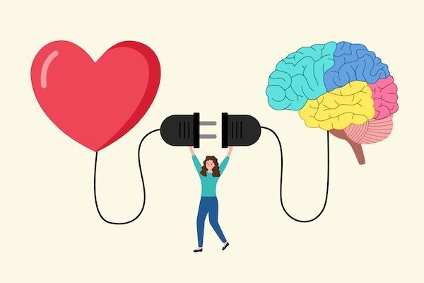 Un cœur et un cerveau reliés par une prise : relier émotions et réflexion