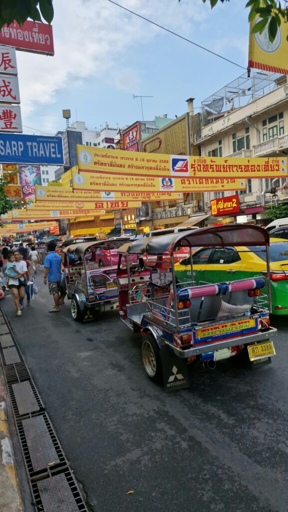 Traffic and yellow banners on Yaowarat Road