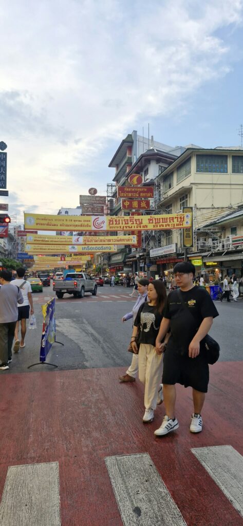 Yellow banners above passers-by in Chinatown
