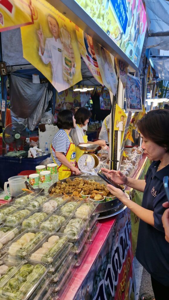 Family in front of a sweets stall in Yaowarat