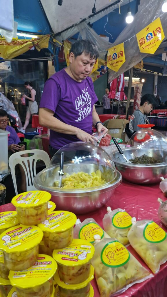 Preparing a vegetarian dish on a stall