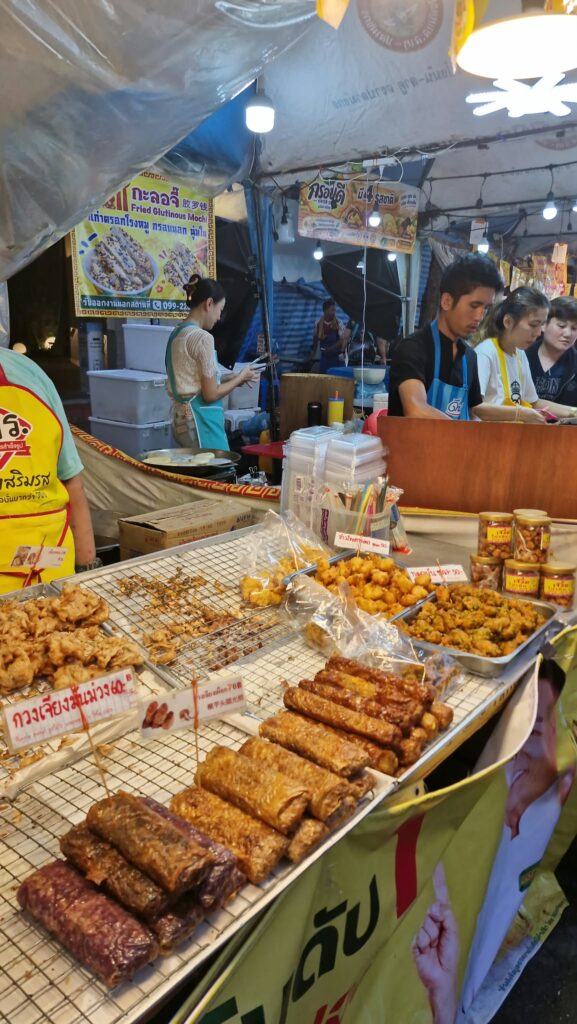 Vendor serving fried jay food in Yaowarat