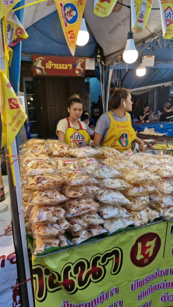Bags of jay snacks piled up on a stall