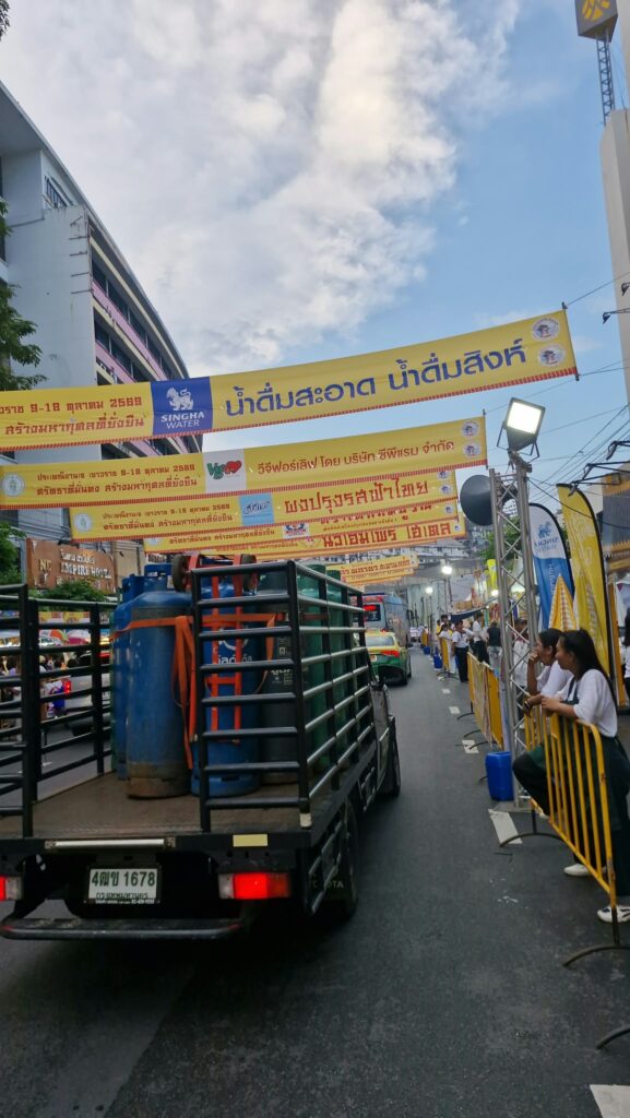 Chinatown street decorated with yellow flags during the festival