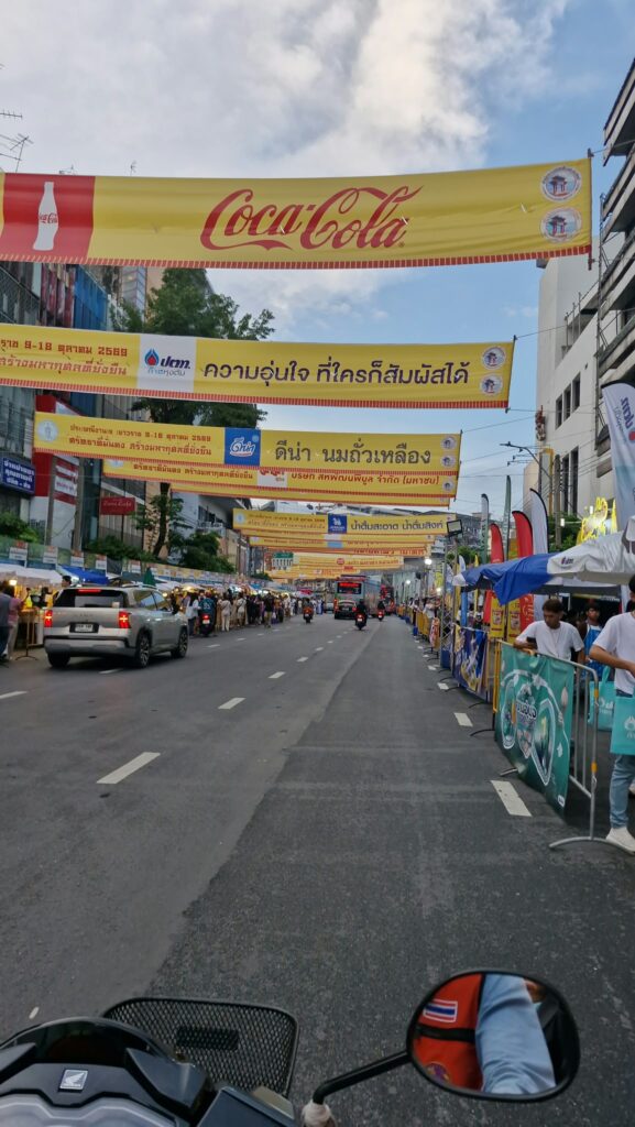 Yellow banners with the red jay character above Yaowarat Road